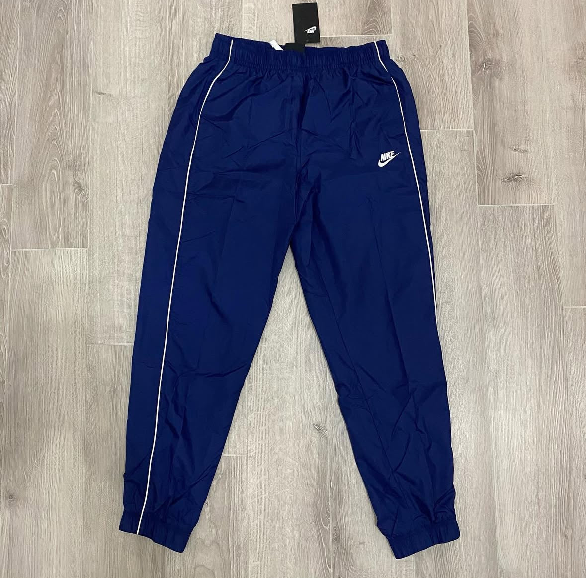 Conjunto NK Tracksuit Relíquia Azul Marinho
